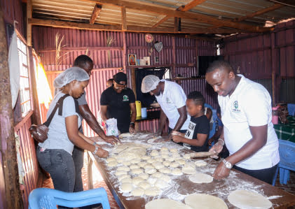 i for you members preparing chapati at a children's home