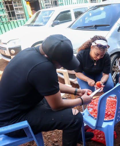 Boy in children's home flashing the peace sign with fingers