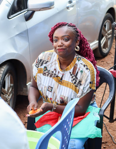 Priscilla Wambui peeling carrots children's home